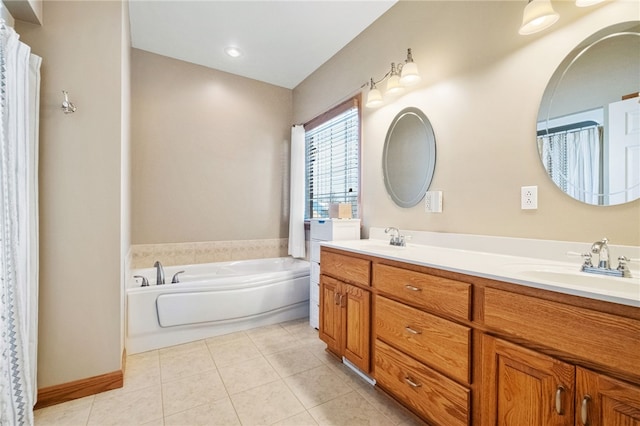 bathroom featuring a washtub, tile patterned floors, and vanity