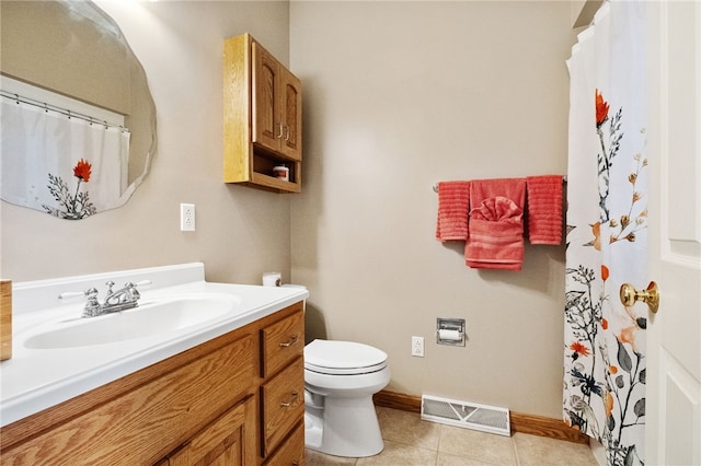 bathroom with toilet, tile patterned floors, and vanity