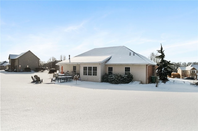 view of snow covered house