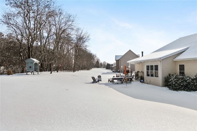 view of yard covered in snow