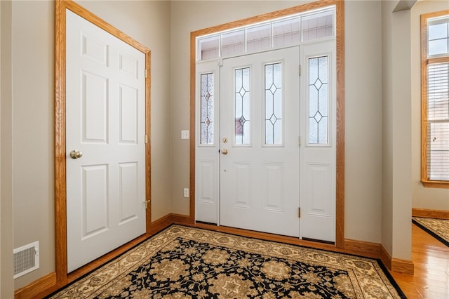 foyer entrance featuring wood-type flooring