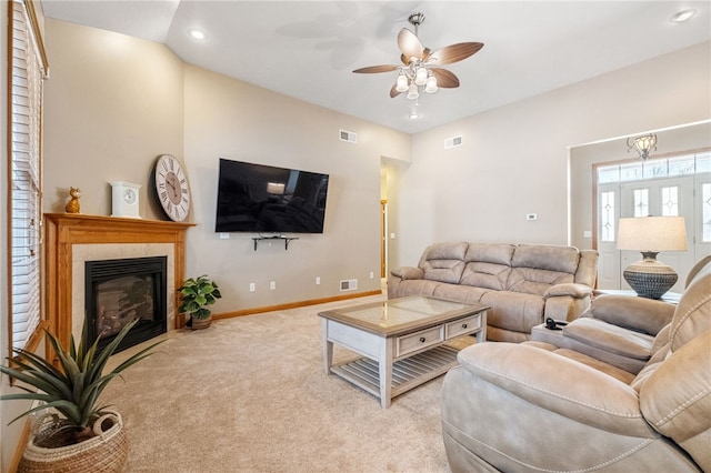 living room with ceiling fan and light colored carpet