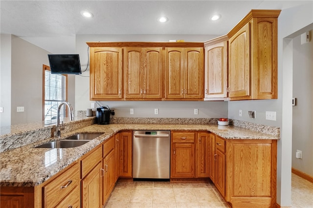 kitchen with kitchen peninsula, dishwasher, sink, and light stone counters