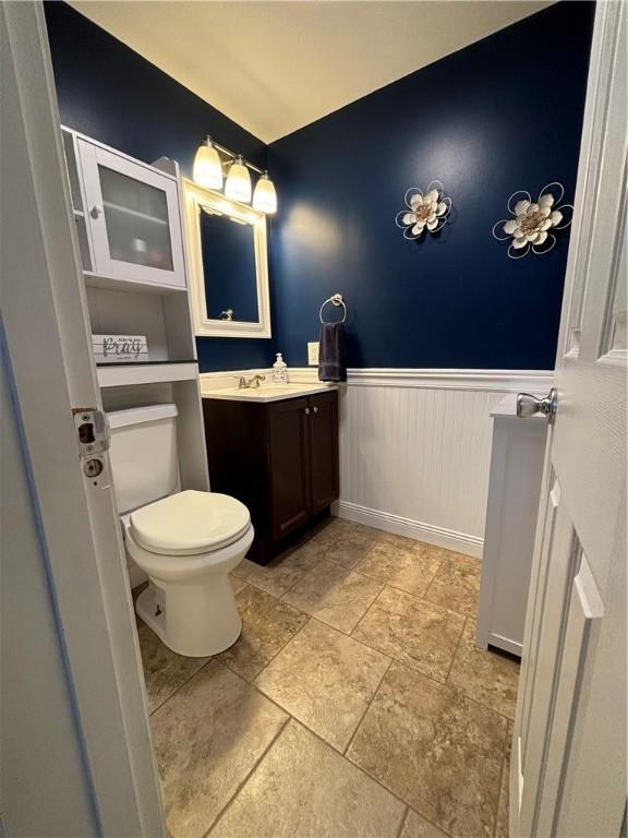 bathroom with toilet and vanity