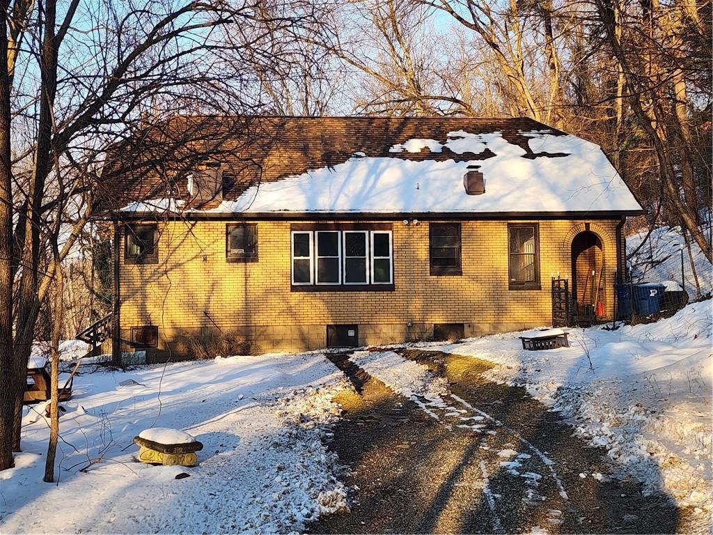 view of front of home featuring cooling unit