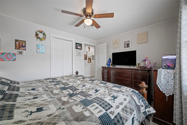 bedroom with ceiling fan and a closet