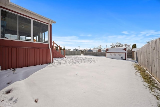 view of yard layered in snow