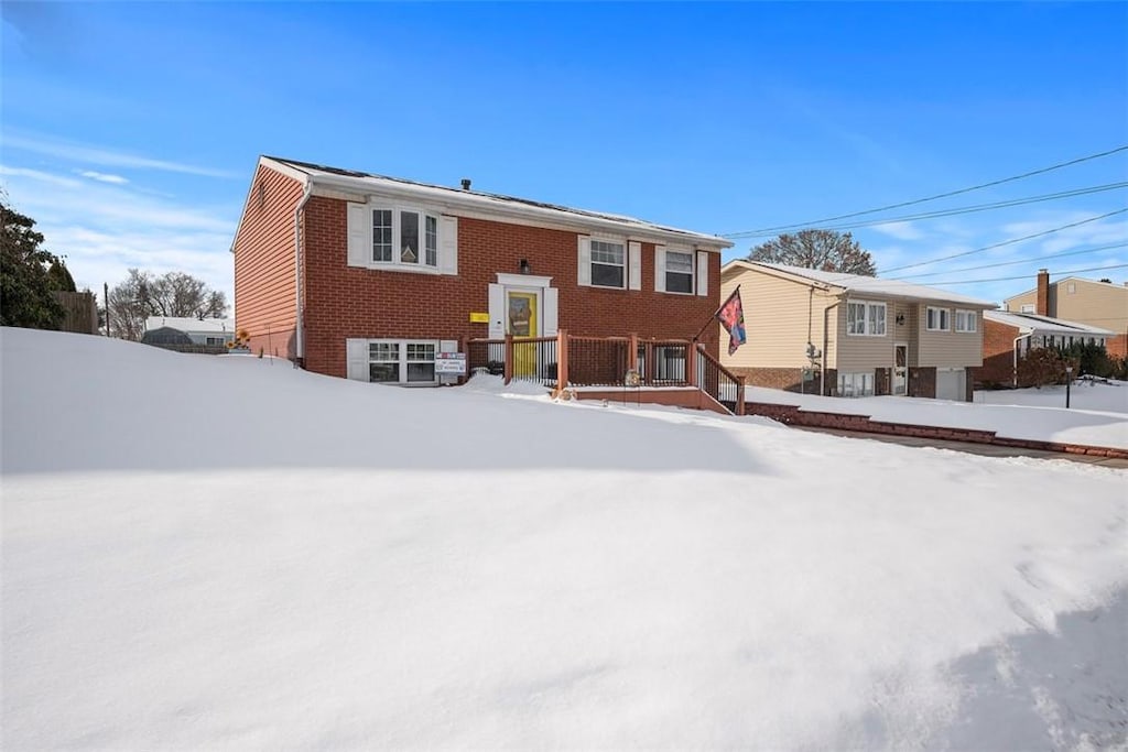 view of snow covered house