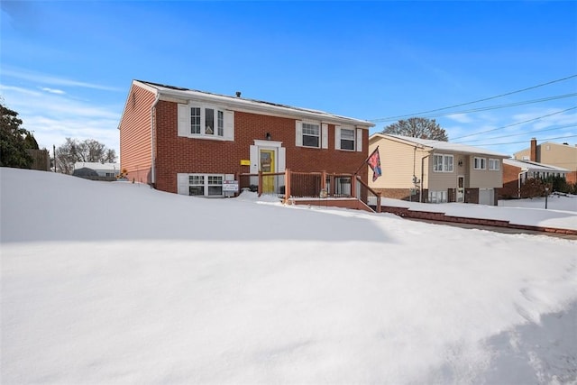 view of snow covered house