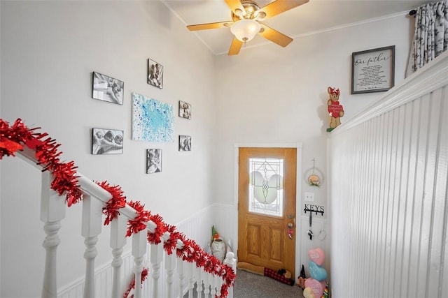 interior space featuring ceiling fan and carpet flooring