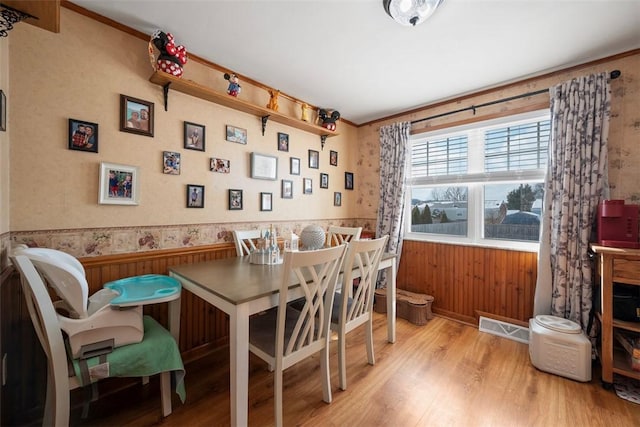 dining space with light hardwood / wood-style floors