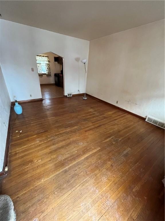 empty room featuring hardwood / wood-style flooring