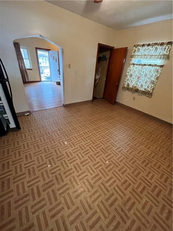 unfurnished room featuring light parquet flooring