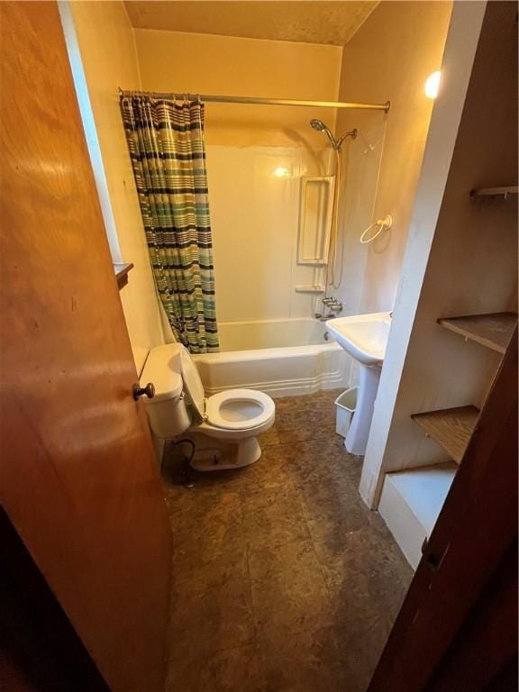 full bathroom featuring toilet, sink, and shower / bathtub combination with curtain