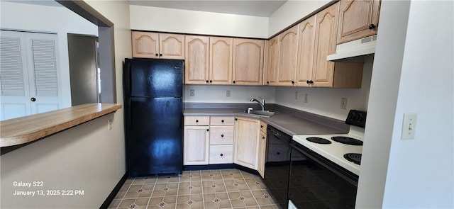 kitchen with black appliances, light brown cabinetry, sink, and dark tile patterned floors