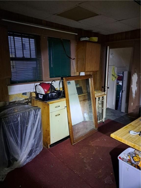 kitchen featuring a paneled ceiling