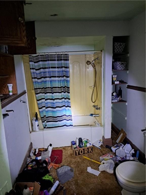 bathroom with toilet and shower / tub combo with curtain