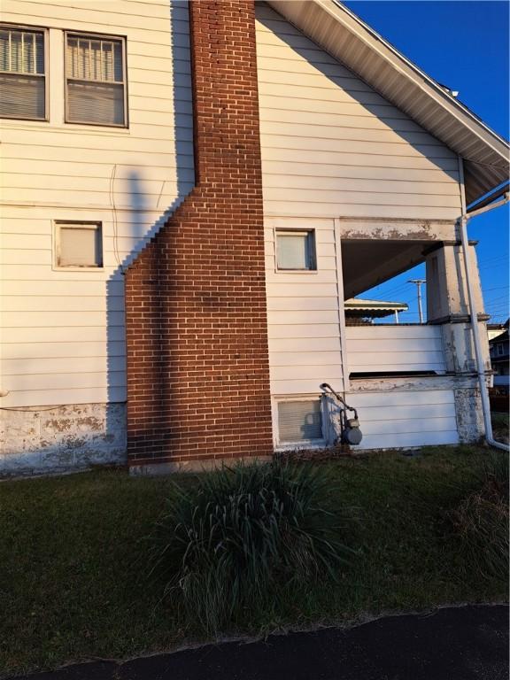 view of home's exterior with a yard