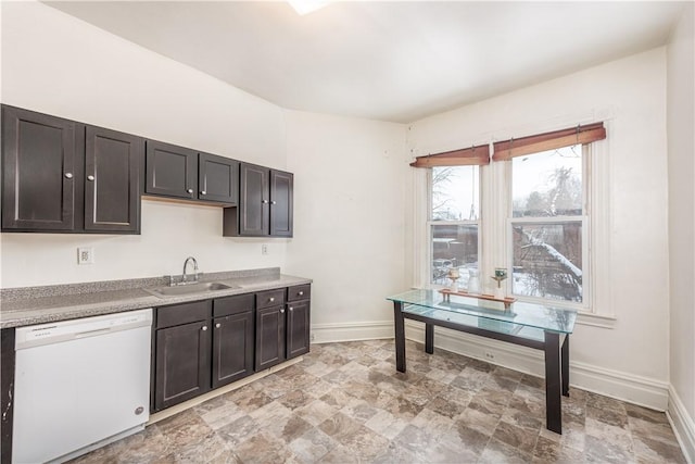 kitchen featuring dishwasher, sink, and dark brown cabinets