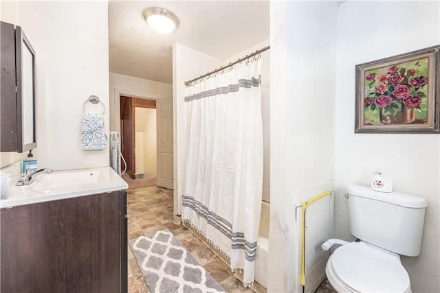 full bathroom with toilet, vanity, and shower / bath combo with shower curtain