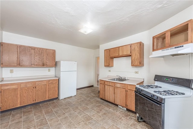 kitchen featuring sink and white appliances