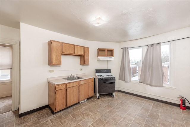 kitchen featuring sink and white gas range oven