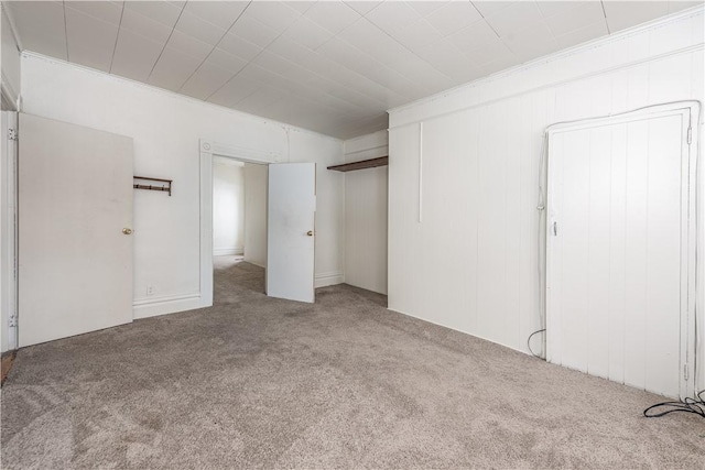 unfurnished bedroom with light colored carpet