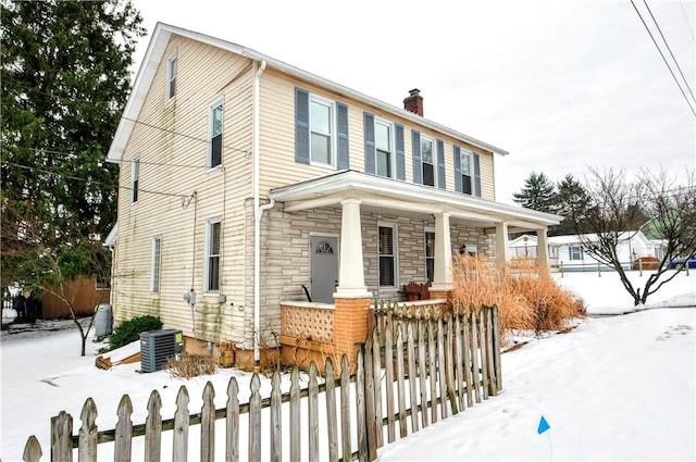 view of front facade featuring central AC unit and covered porch