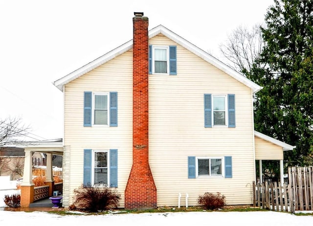 view of property exterior with covered porch