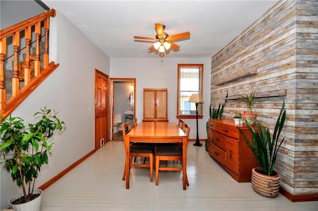 dining room with light wood-type flooring and ceiling fan