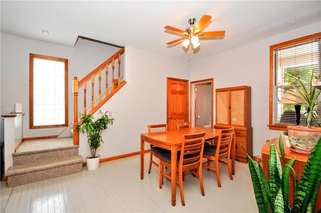 dining area featuring ceiling fan and light hardwood / wood-style flooring