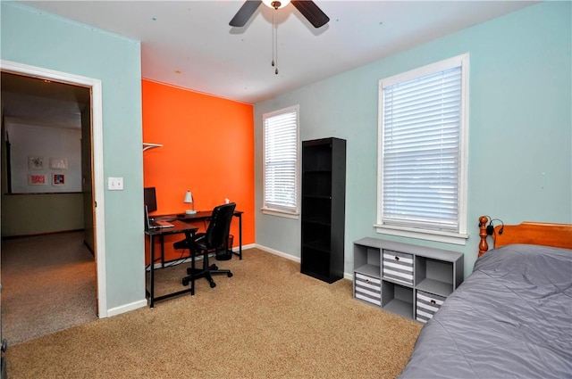 bedroom with ceiling fan and light carpet