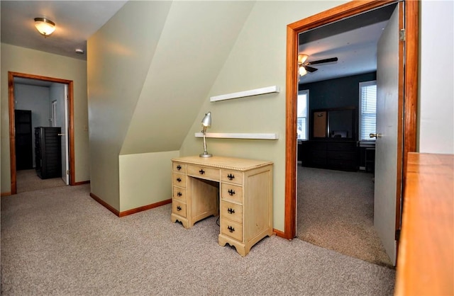 carpeted home office with ceiling fan