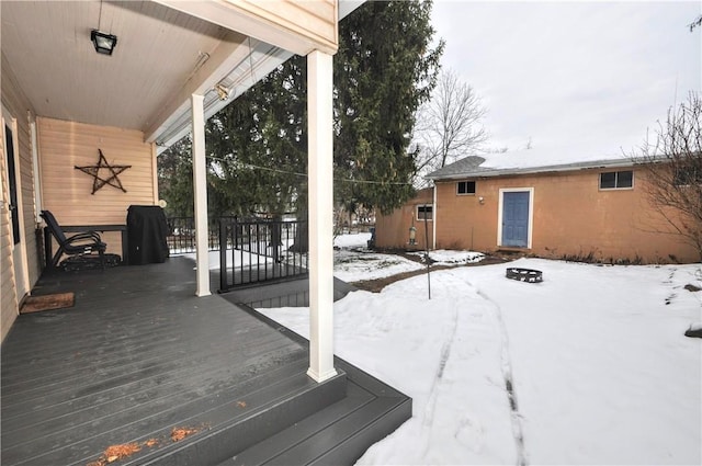 view of snow covered deck