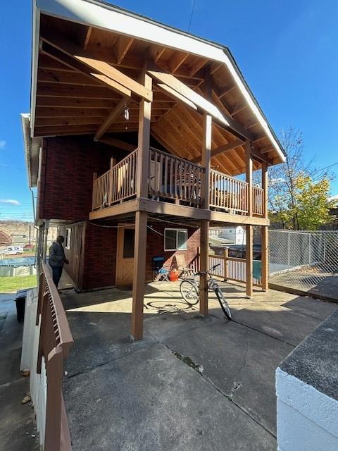 view of play area with a deck and a patio area