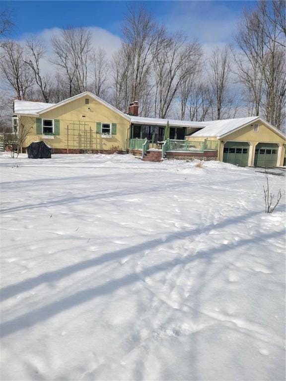 view of front of house with a garage and a porch