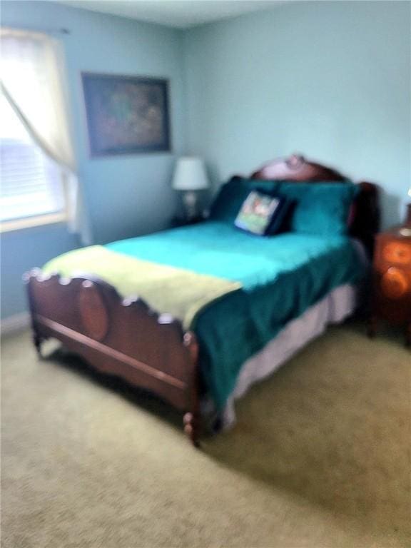 bedroom with light colored carpet