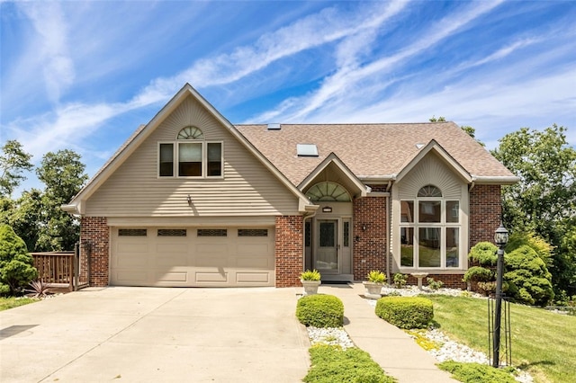 view of front of house with a front yard and a garage