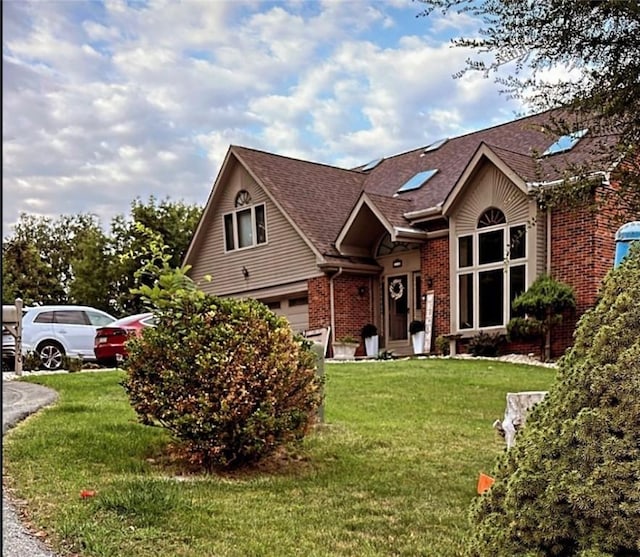 view of front facade with a front lawn and a garage