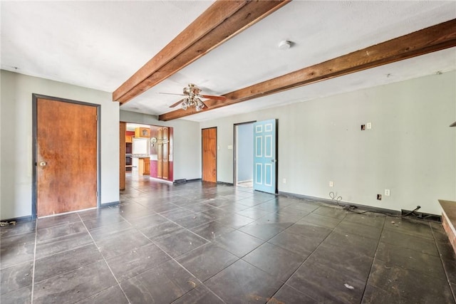 unfurnished room featuring ceiling fan and beam ceiling