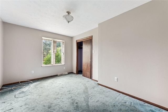 unfurnished bedroom featuring carpet