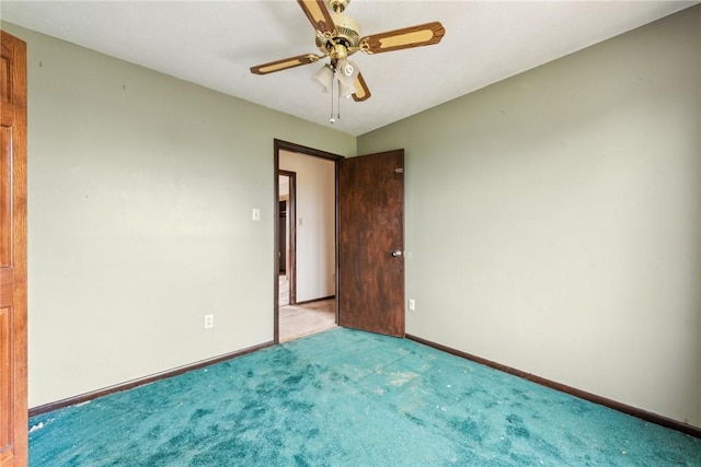 unfurnished room featuring ceiling fan and light colored carpet