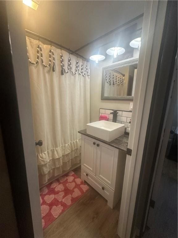 bathroom featuring hardwood / wood-style flooring and vanity