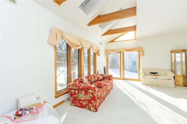 interior space featuring beam ceiling and high vaulted ceiling