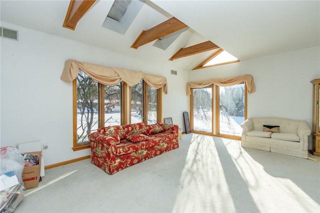 living room featuring vaulted ceiling with beams