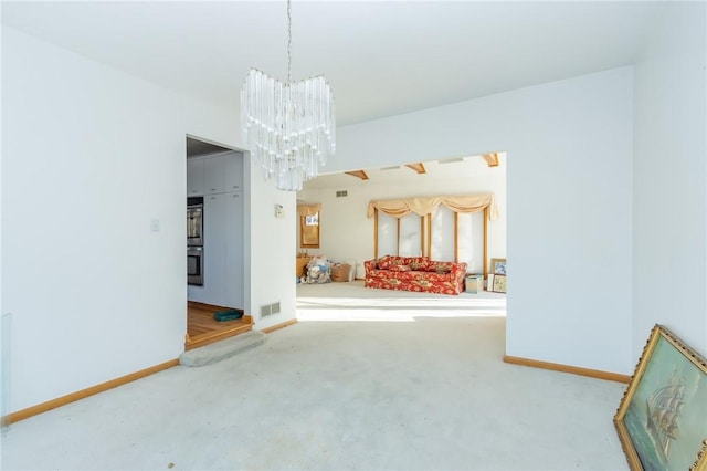 spare room featuring a notable chandelier