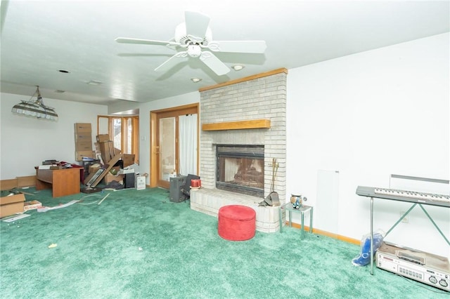 carpeted living room with ceiling fan and a fireplace