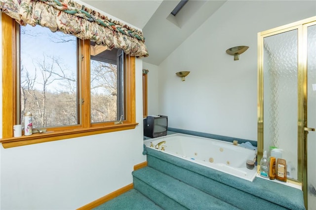 bathroom featuring a bathing tub and lofted ceiling