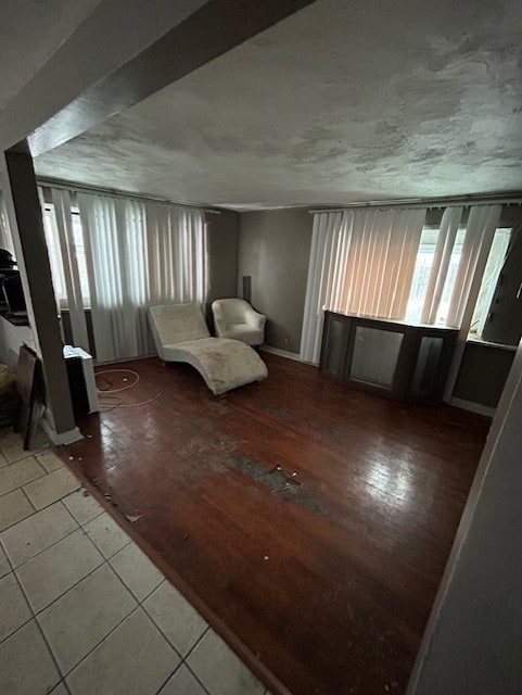 unfurnished room featuring a healthy amount of sunlight and tile patterned floors