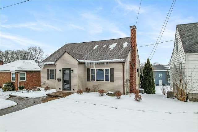 bungalow-style house featuring central AC unit